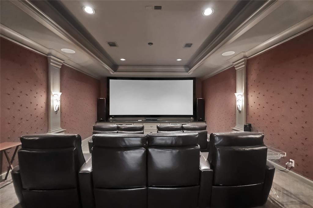 Media Room on the first level offers curved screen and theater seating for movie time ANYTIME!