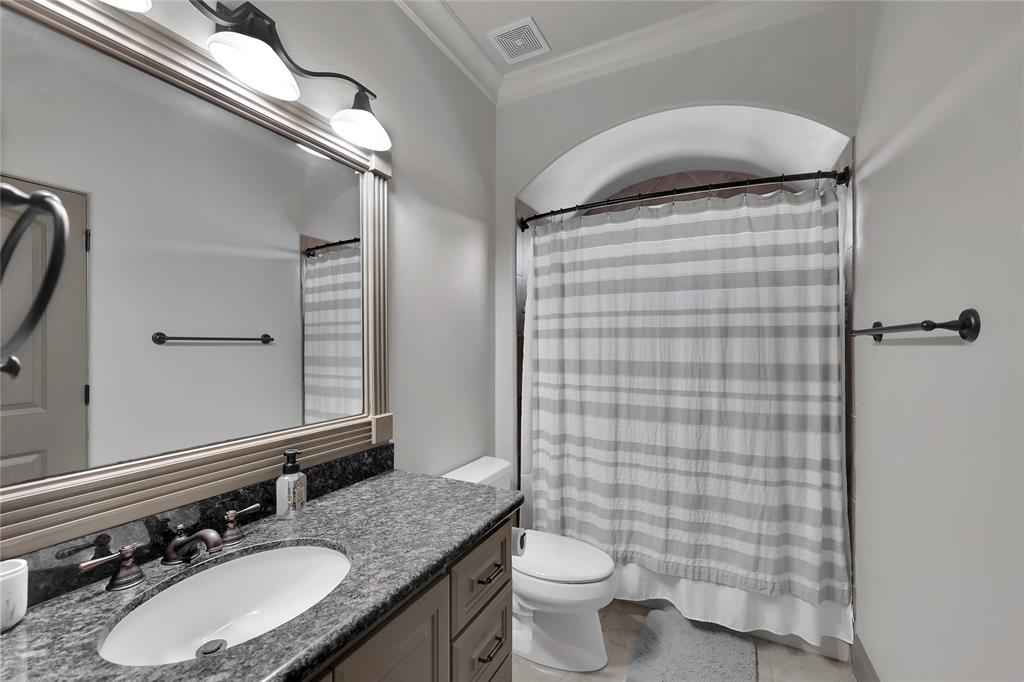 Additional Full Bathroom offered gorgeous grey tone granite counter tops, tile flooring and an extended frame mirror.