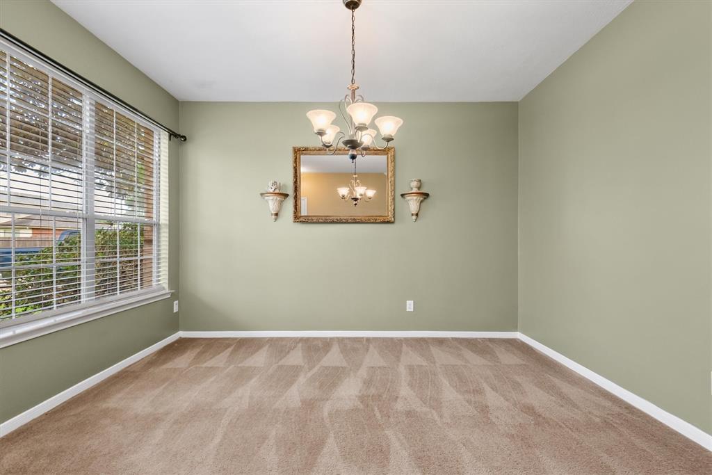 Two story brick home with beautiful Magnolia tree in front