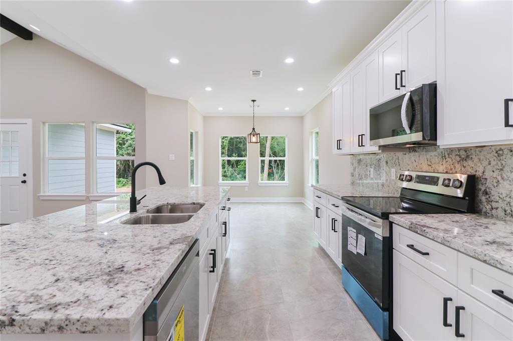 Granite Counter Tops, Stainless Steel Appliances, & tons of recessed lighting