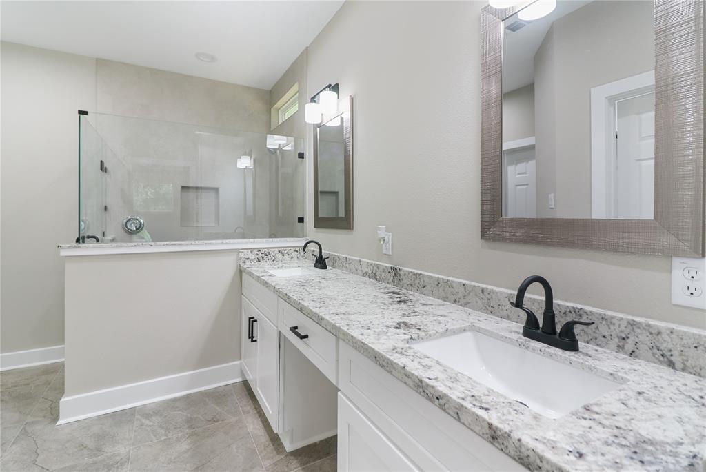 Over sized Walk in Shower with custom tile, soap shelf, & glass surround