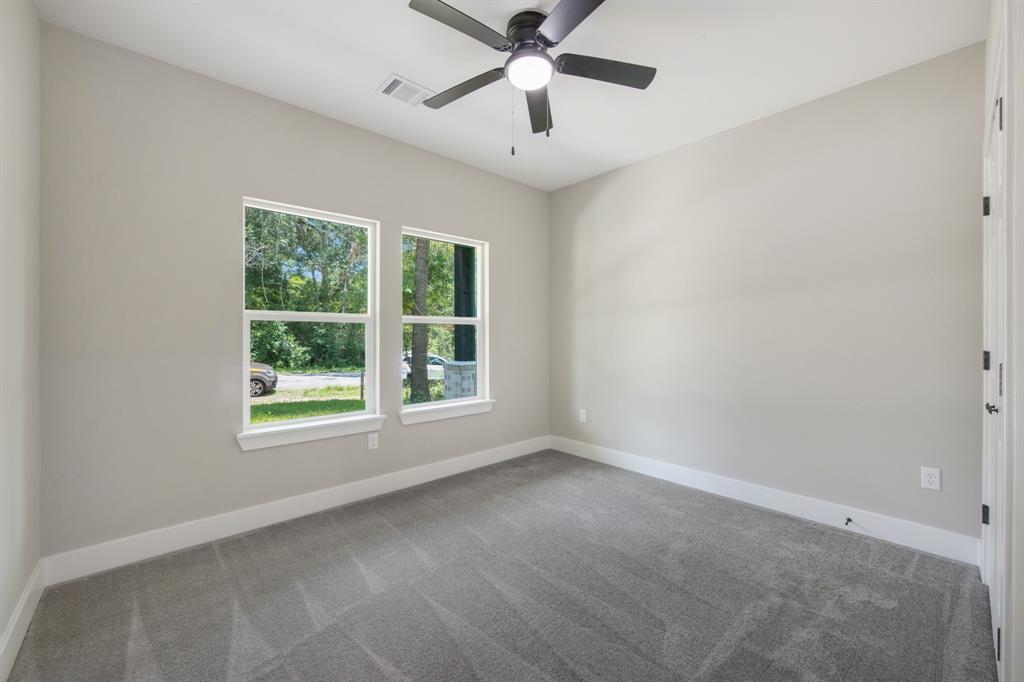 Spacious In-House utility room with enclosed cabinet, soap shelf, and hanging rack