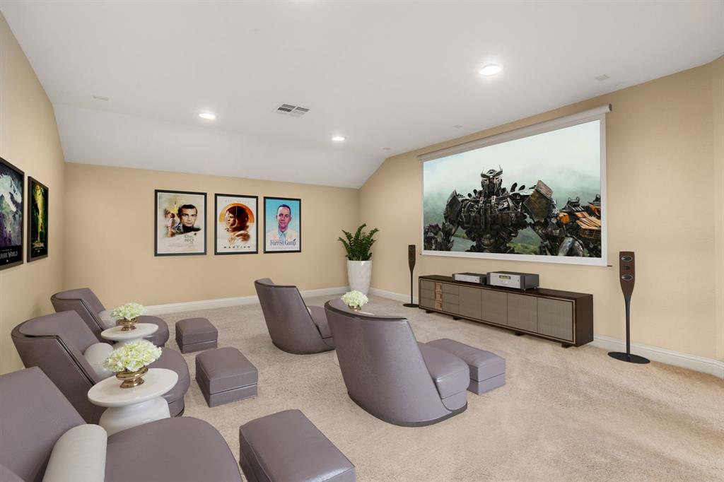 Grab the popcorn, put on a movie, and enjoy a wonderful evening in your amazing media room! Featuring plush carpet, custom paint, and custom lighting that makes this the perfect room for relaxing.