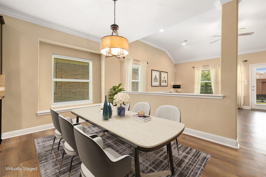 Start your day off right with a cup of coffee sitting with your family in the lovely breakfast area! Featuring large windows with blinds, custom paint, wood flooring and beautiful chandelier.