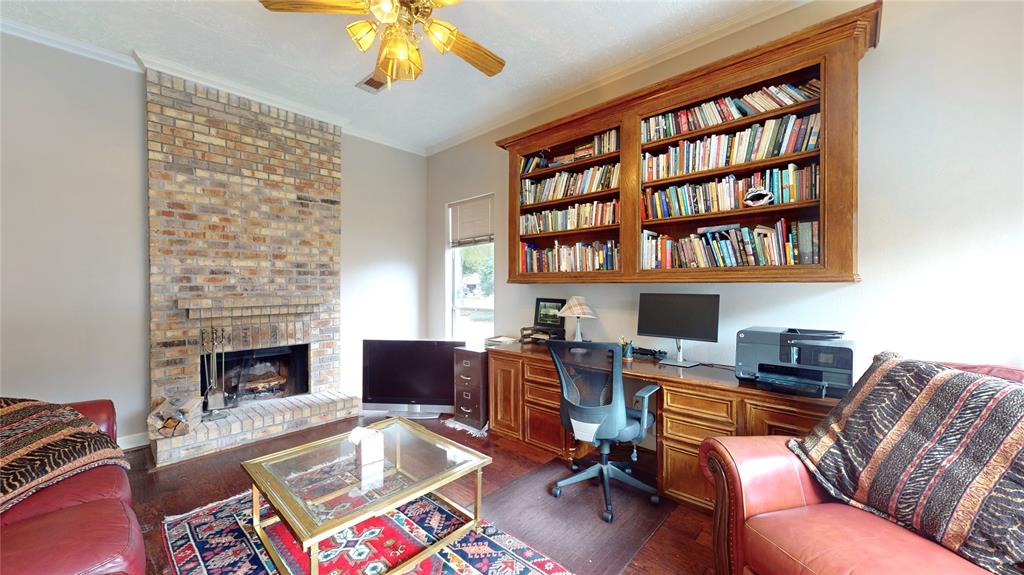 The office with its built-ins looks out over the pool.