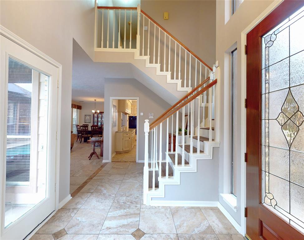 A view from the living room toward the windows overlooking the pool.