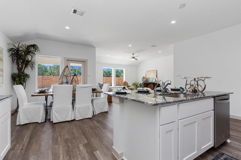 The Gourmet Kitchen flows into the Casual Dining and Huge Family Area all looking out to your Private Backyard!