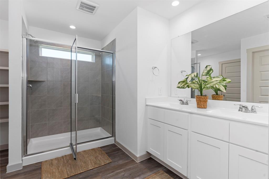 Massive Seamless Glass Shower for Two! Never have to wait for the Water to Get Hot after someone takes a shower due to the Tankless/On-Demand H2O Heater your will never run out of Hot Water!