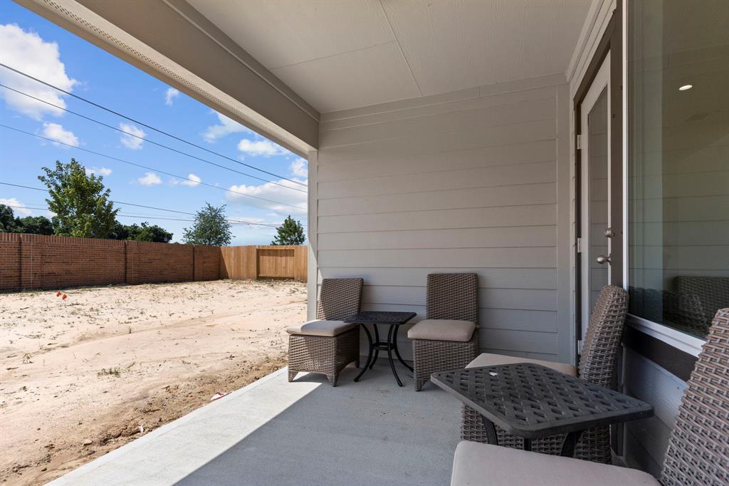 Covered Patio to enjoy that cup of tea after a stressful Day! Home is ready for you to move in today!  No one behind your but the trees!