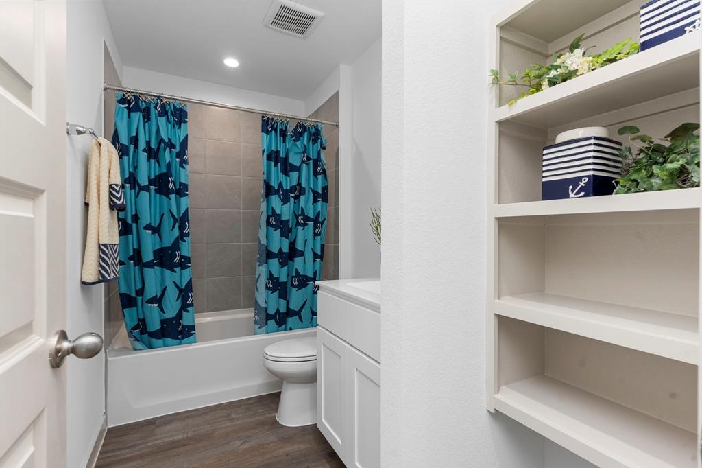 The Guest Bathroom has Tub and Shower combination with Beautiful Tile Surroundings, Vinyl Like Wood Floors, and beautiful Cultural Marble Vanity with Beautiful Bathroom Shaker Cabinets! All of our bathrooms have Elongated commodes!