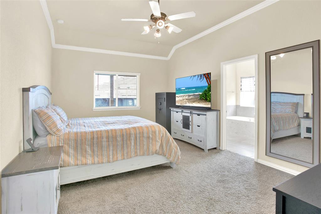 The entry into nicely sized owners retreat with high ceilings and crown molding.