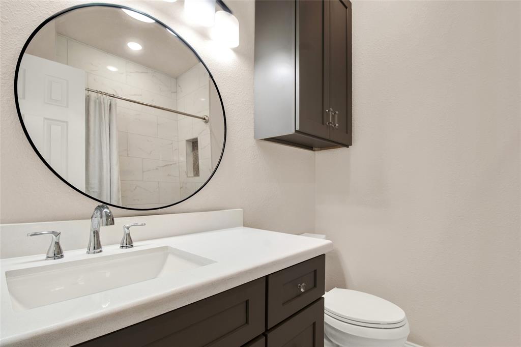 Secondary Bath - quartz vanity; custom step-in shower