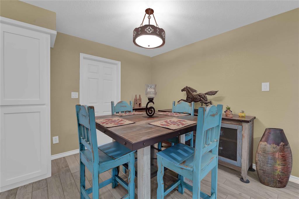 Dining room. Door leads to utility room. Super convenient. This home has a great floor plan!