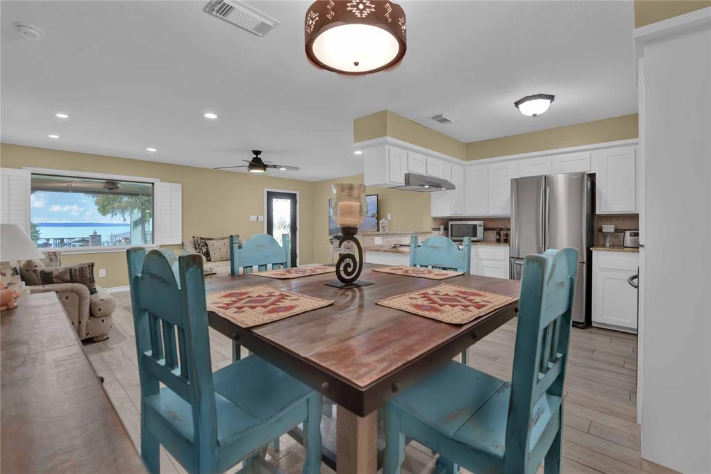 View from the dining room through to the kitchen and family room. Great for entertaining and everyone gets that view!