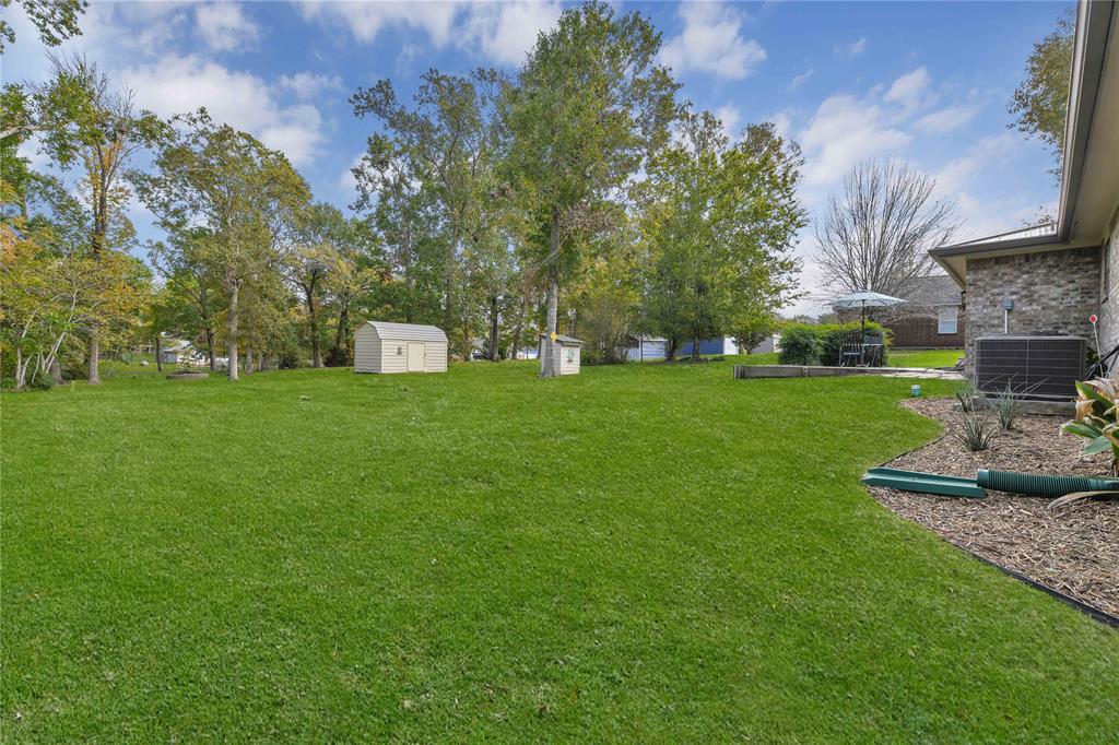 How about this back yard! That is an awesome shed for storage and it also has electricity ran to it so great option for a man cave!