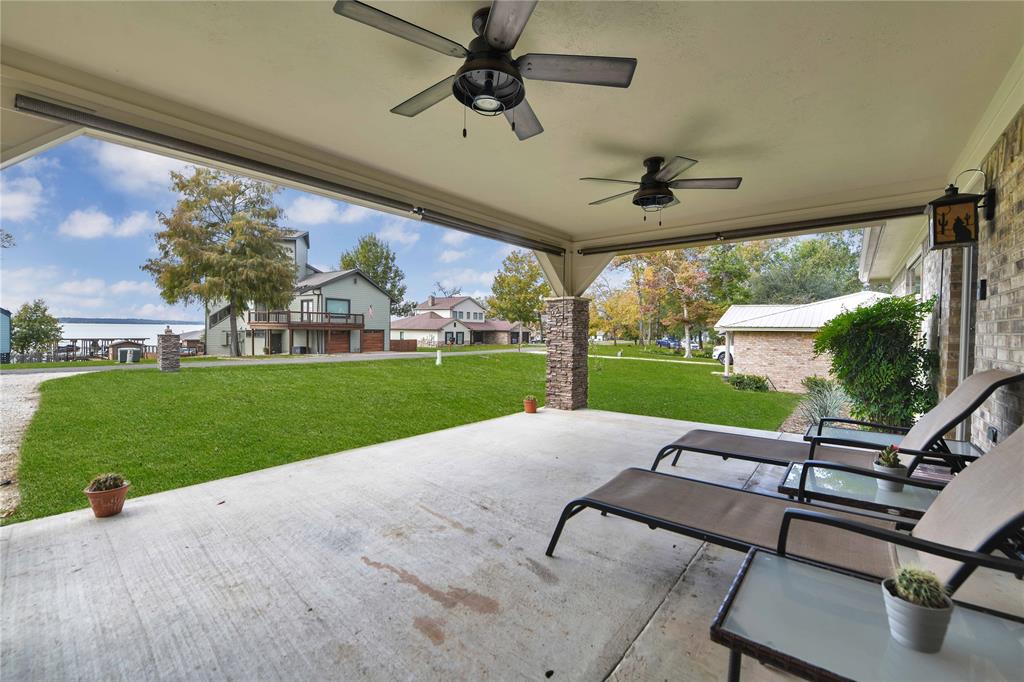 Front porch sitting is where you will be for morning coffee and evening wine!  Cool off with the double ceiling fans plus there are sun screens you can lower if it\'s too bright/hot!