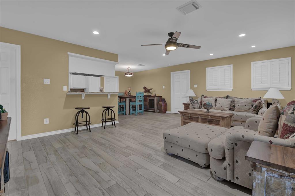 Family room view as you enter the home! Beautiful porcelain tile throughout home as well as plantation shutters. Fresh paint and a great breakfast bar to grab a snack!