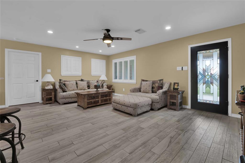 Family room view. Love that leaded glass front door PLUS there is another full glass exterior door on the outside. Door leads to the owner\'s retreat.