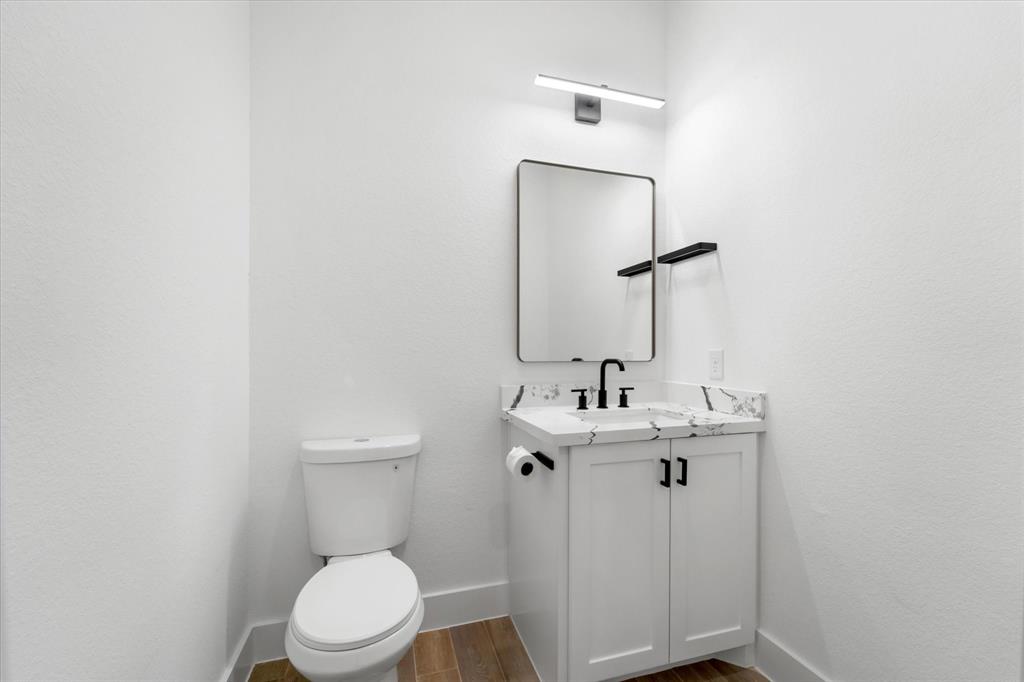 The landing upstairs lets in plenty of natural light and a storage closet is pictured on the left.