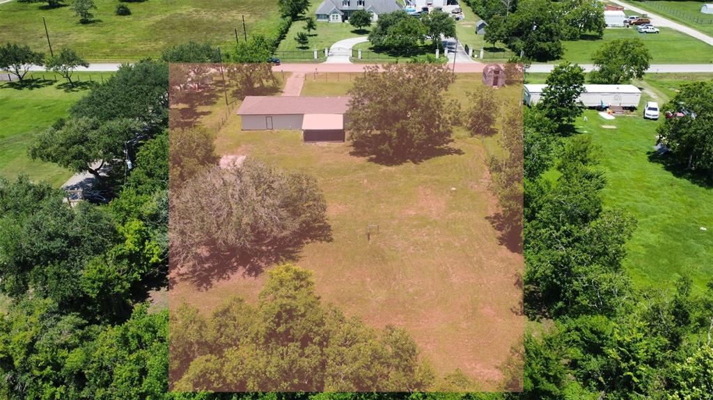 drone photo with approximate property lines in shaded area