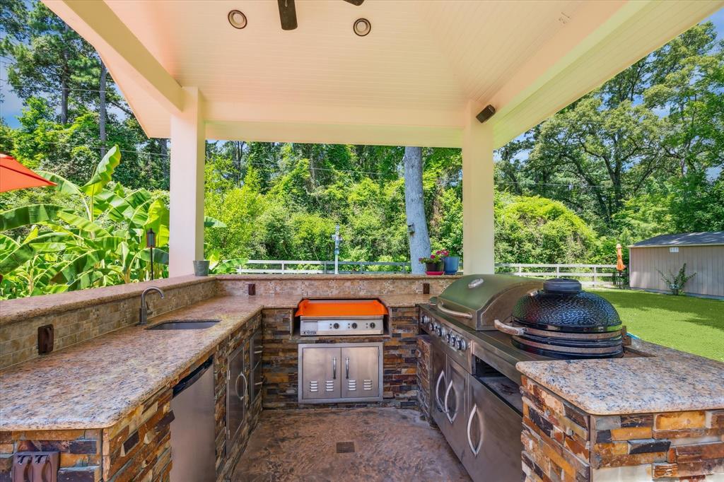 Outdoor kitchen w/frig, sink, gas grill and smoker