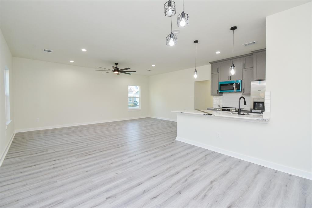 View from dining area to the kitchen and family room.