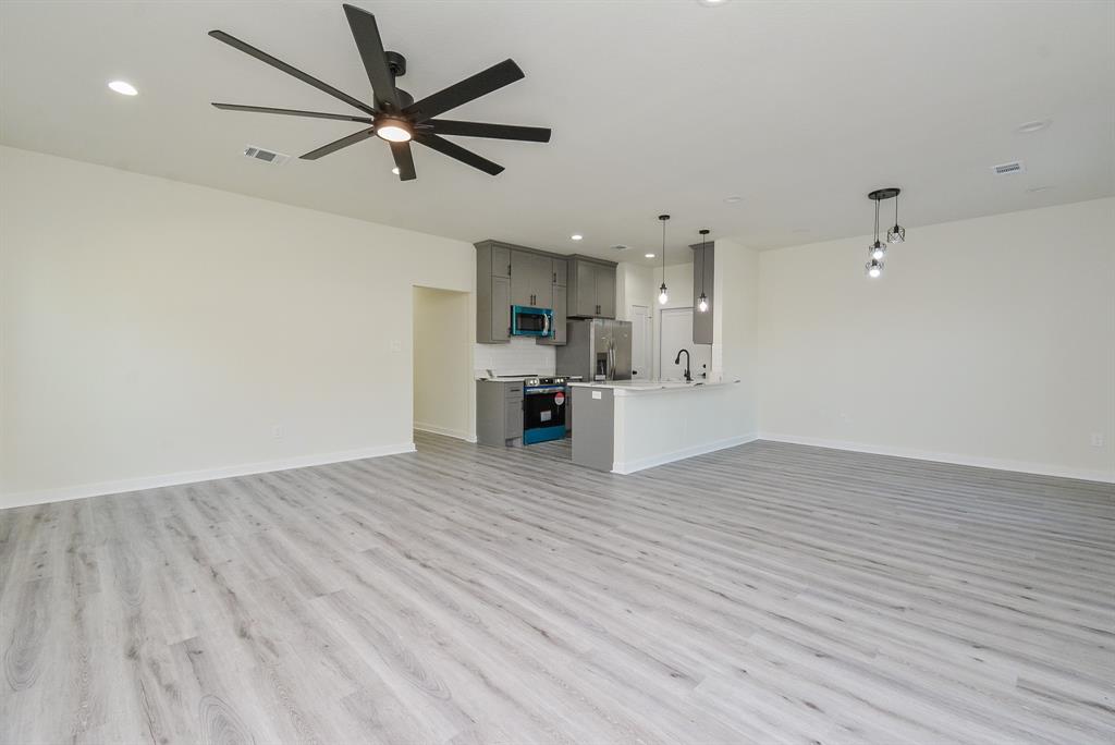 View from living space to kitchen and dining area.