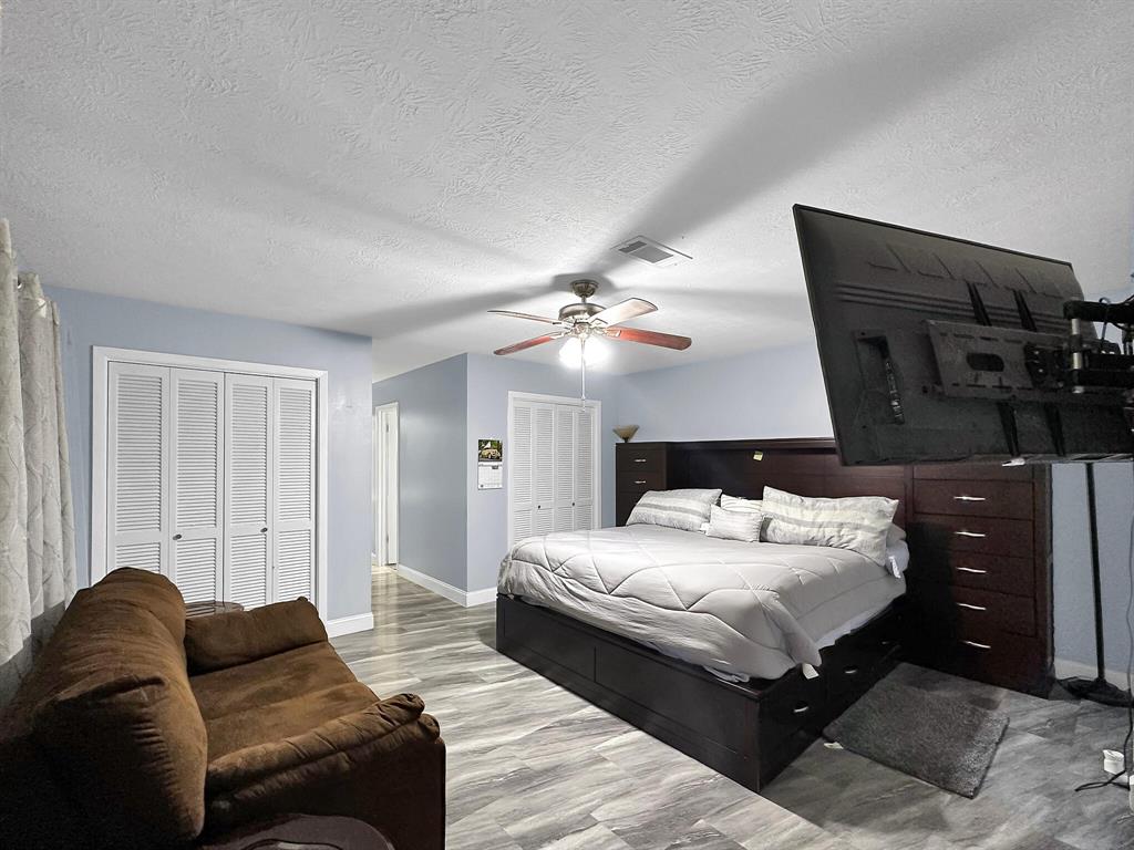 The large primary bedroom offers a spacious retreat for relaxation and comfort.