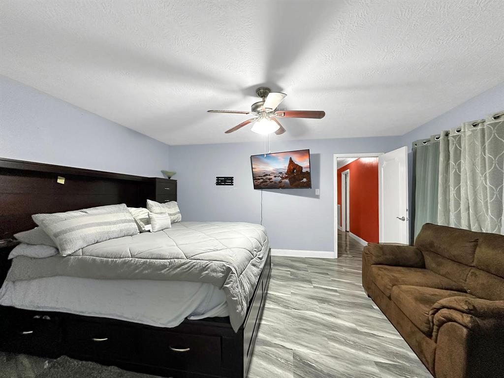 The large primary bedroom offers a spacious retreat for relaxation and comfort.