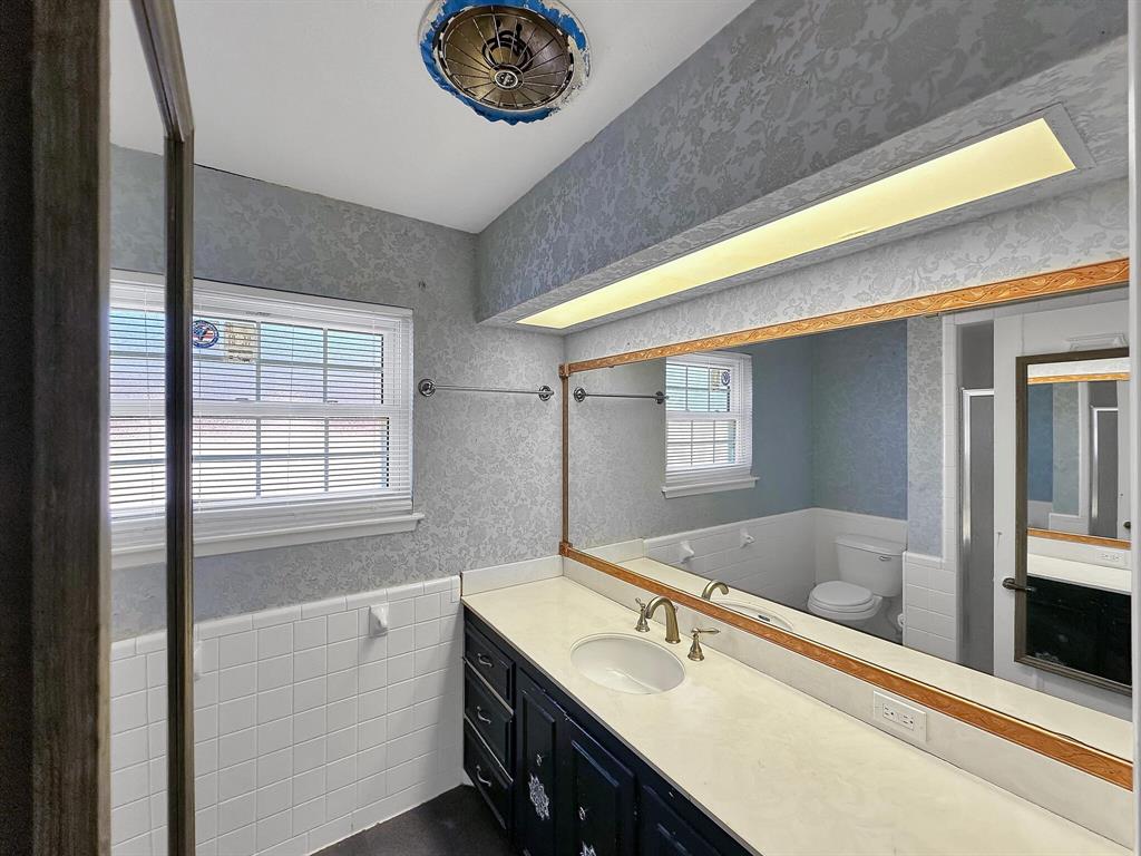 The large secondary bathroom offers ample space and modern amenities.