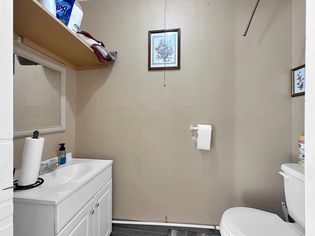 The home includes a spacious half bath, perfect for guests.