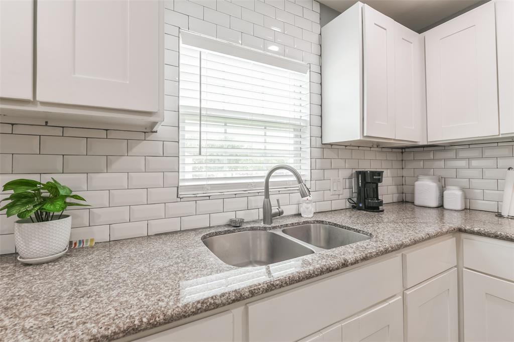 Kitchen features an abundance of cabinets offering ample storage, stainless steel appliances and granite countertops