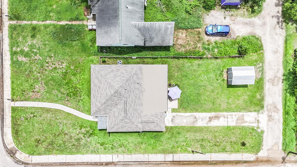 Aerial view of the home located on a corner lot