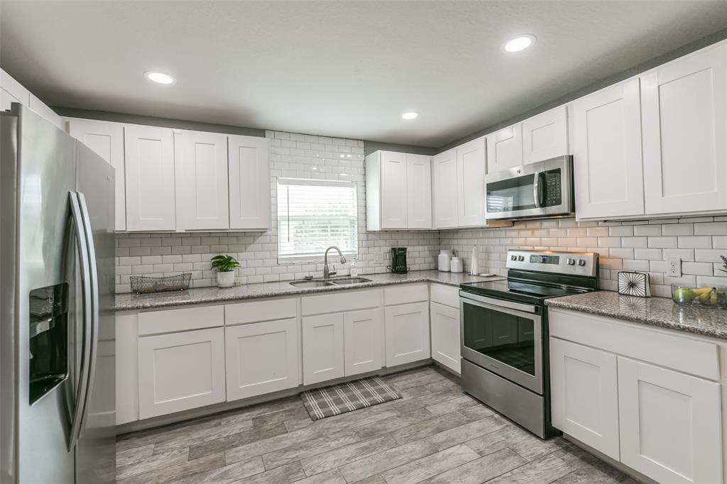 Kitchen features an abundance of cabinets offering ample storage, stainless steel appliances and granite countertops