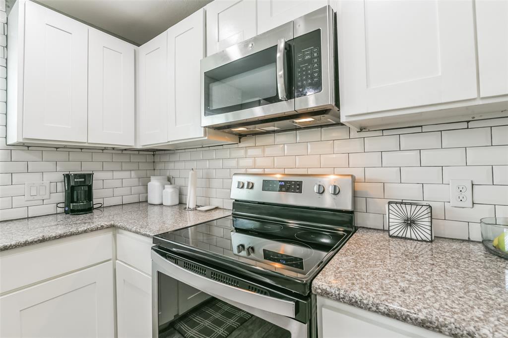 Kitchen features an abundance of cabinets offering ample storage, stainless steel appliances and granite countertops