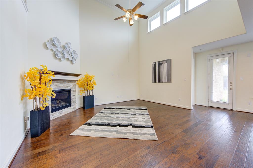 Another view of the family room.  To the right is the kitchen and door at the end of the room is to the backyard/covered patio.