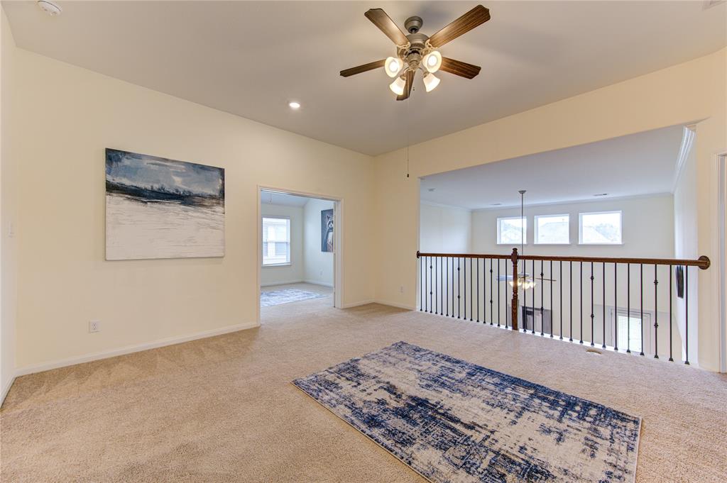 Second living space or gameroom at the top of the stairs, overlooking the family room.