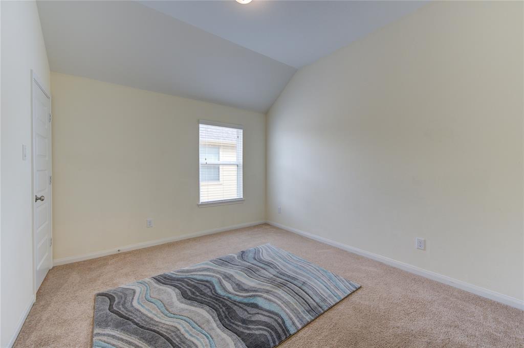 Bedroom number 3, upstairs.  This room has plush carpet, angled ceiling as well as the natural light we have been seeing throughout the home.