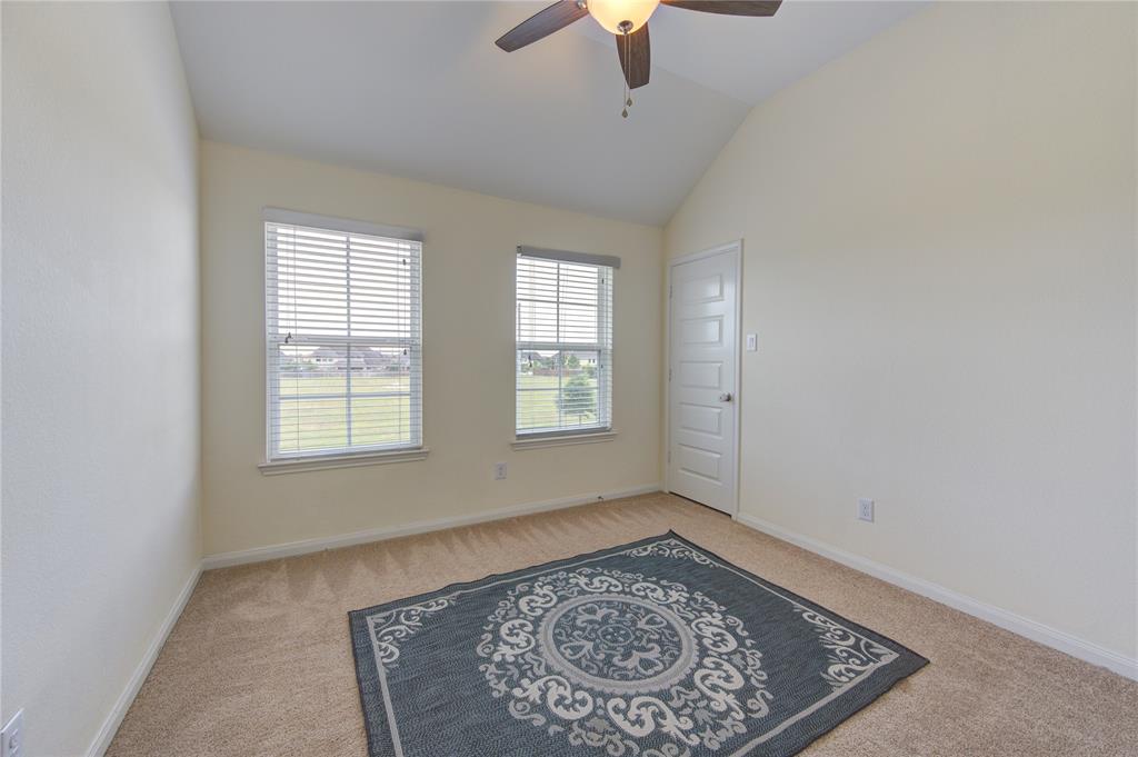 Bedroom number 4, upstairs.  This room has plush carpet, angled ceiling as well as two windows that are almost the length of he wall.  Great natural light in this room.