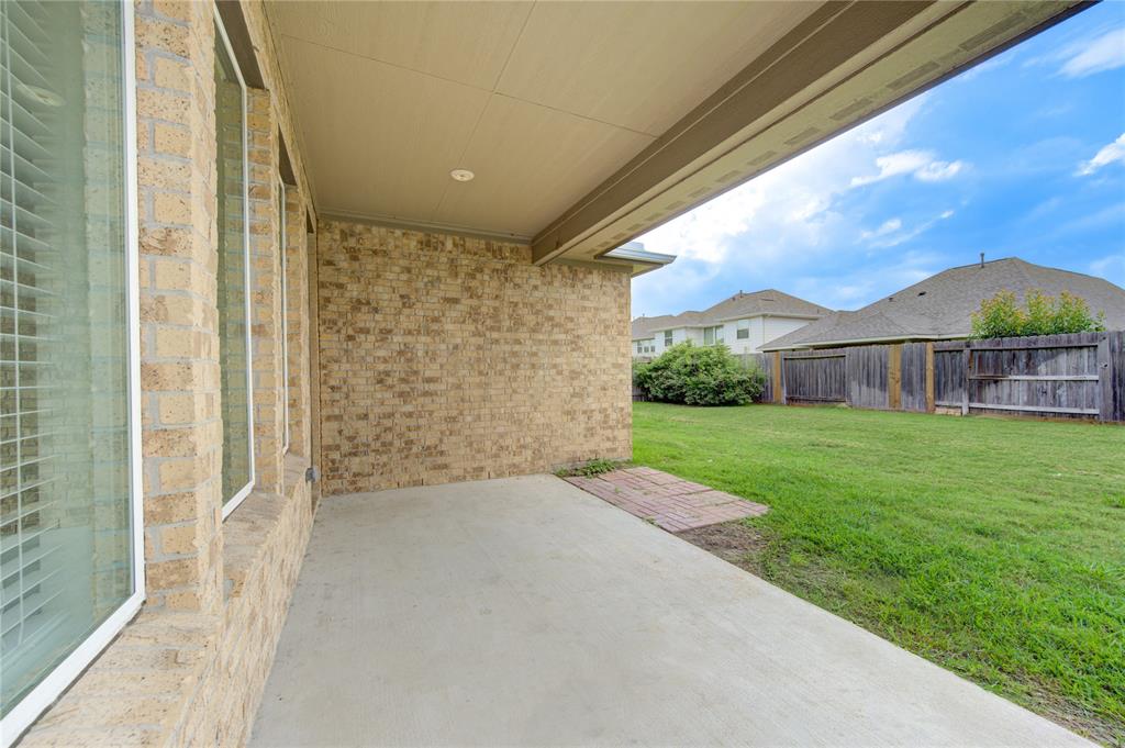 Covered back patio.  Plenty room for grilling for friends and family.