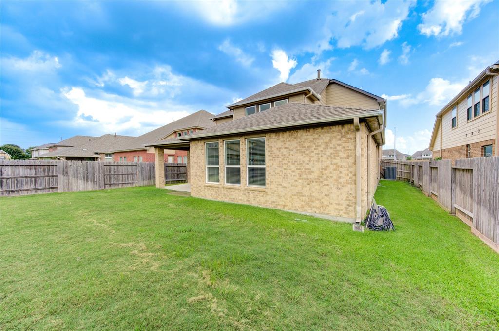 There is about the same amount of side yard on both sides of the house.  Plenty room to build a dog run, a garden, or just have addditional green space around your home.