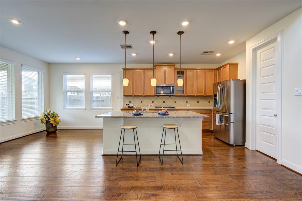 Great view of open kitchen.  To the left is breakfast/dining space.