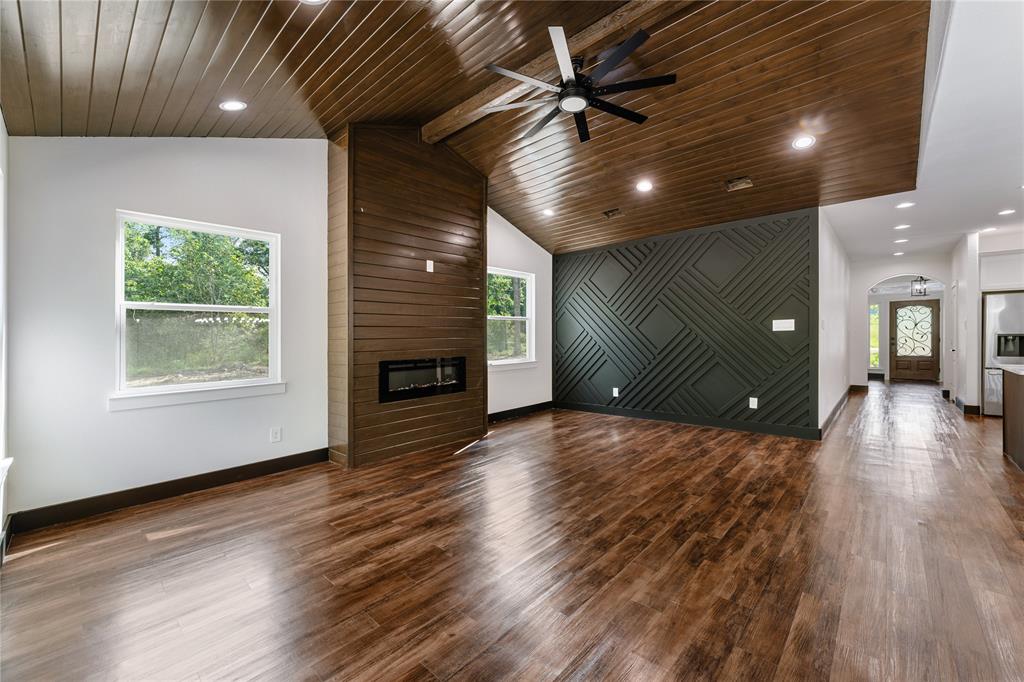 Black accent wall with wood molding.