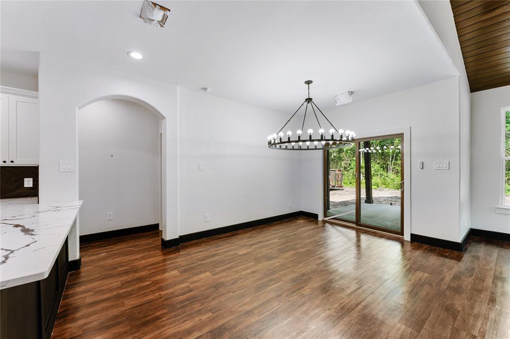 Views to covered patio and backyard with plenty of trees.