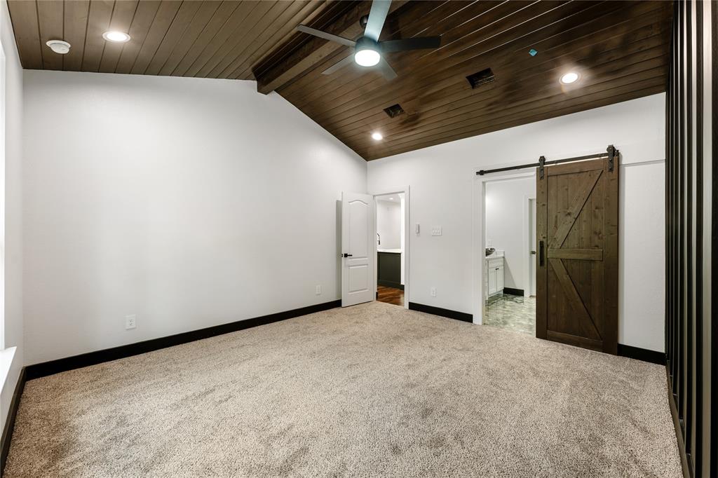 Sliding barn door into primary bathroom.