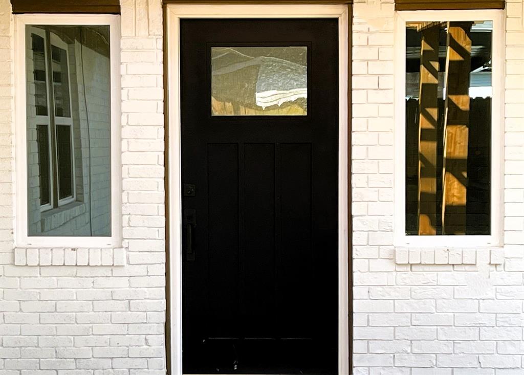 New front door w/side windows.