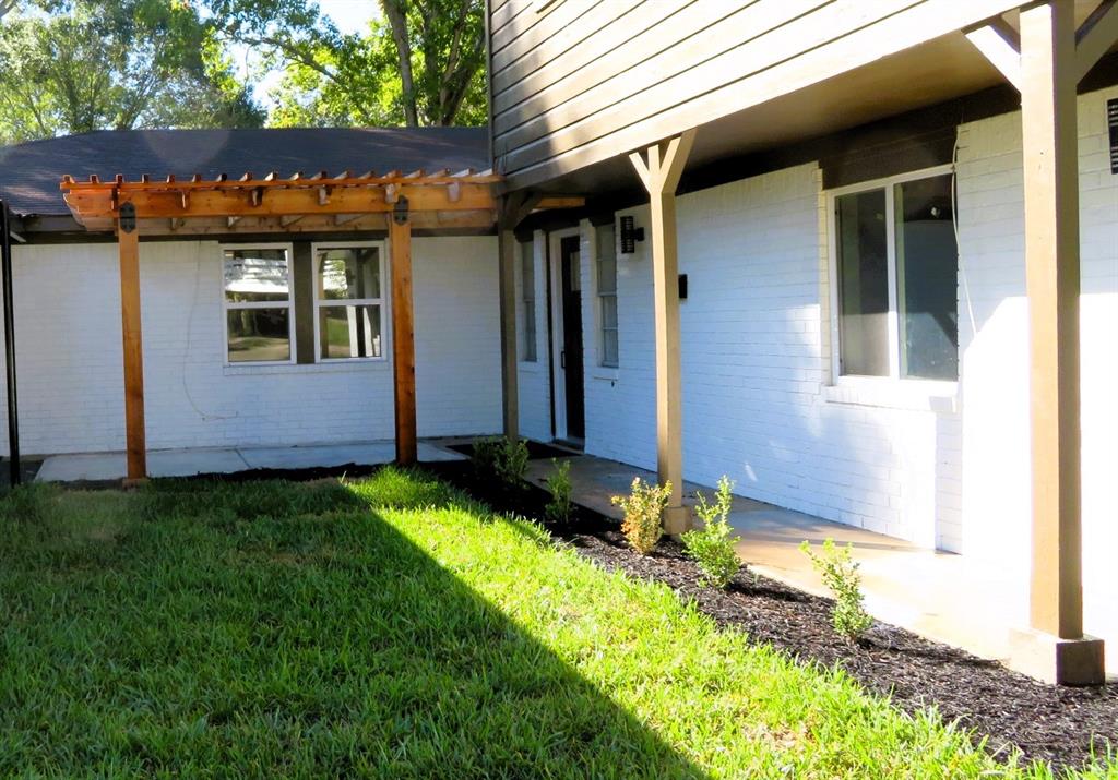 Front view w/ cedar pergola