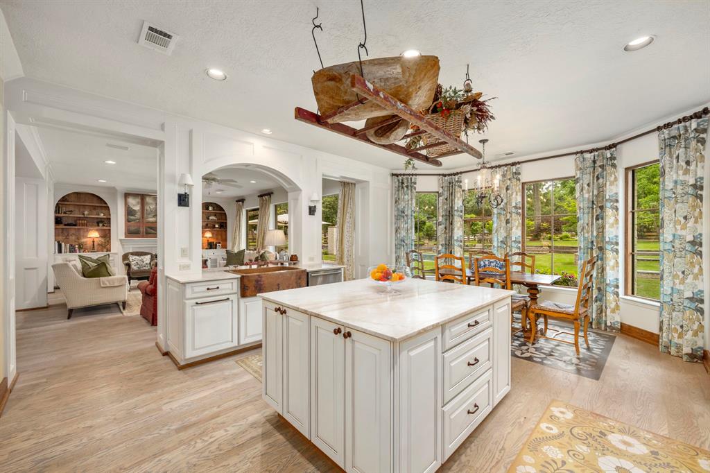 View of the kitchen as you enter from the living room....no detail has been overlooked in this ultimate entertaining kitchen and breakfast area. Custom built and well designed to optimize space, yet beautiful to look at. Enjoy plenty of storage, prep and serving space.