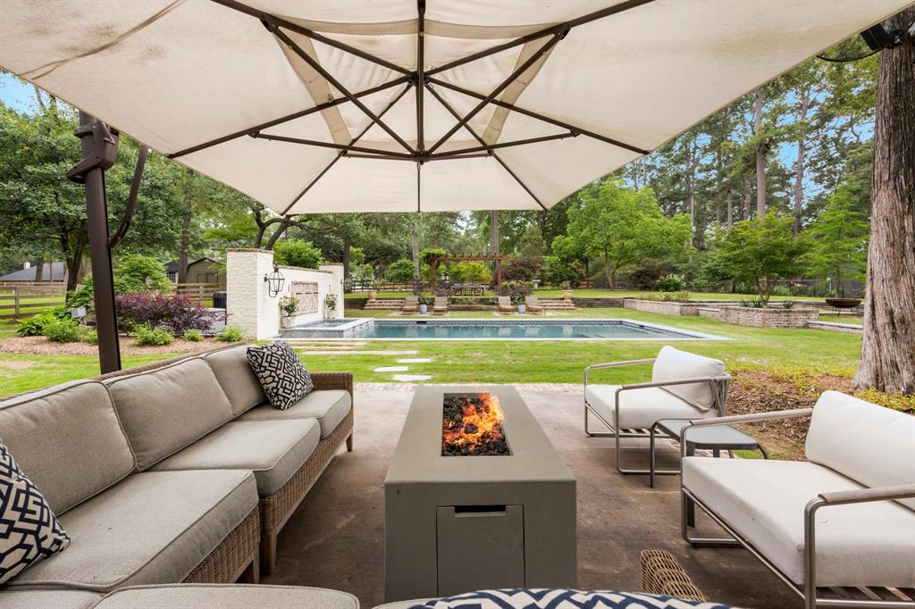 If you wish to relax and live outdoors - this is your space! Nestled under the shade of the commercial grade umbrella and a beautiful tree, you will find outdoor fans, gorgeous views and the privacy this property has to offer.