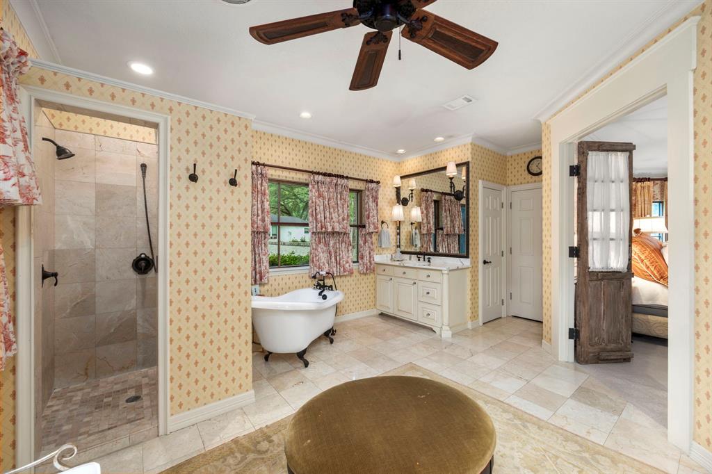 Primary bath with soaking , separate walk in shower, dual vanities and a dressing area